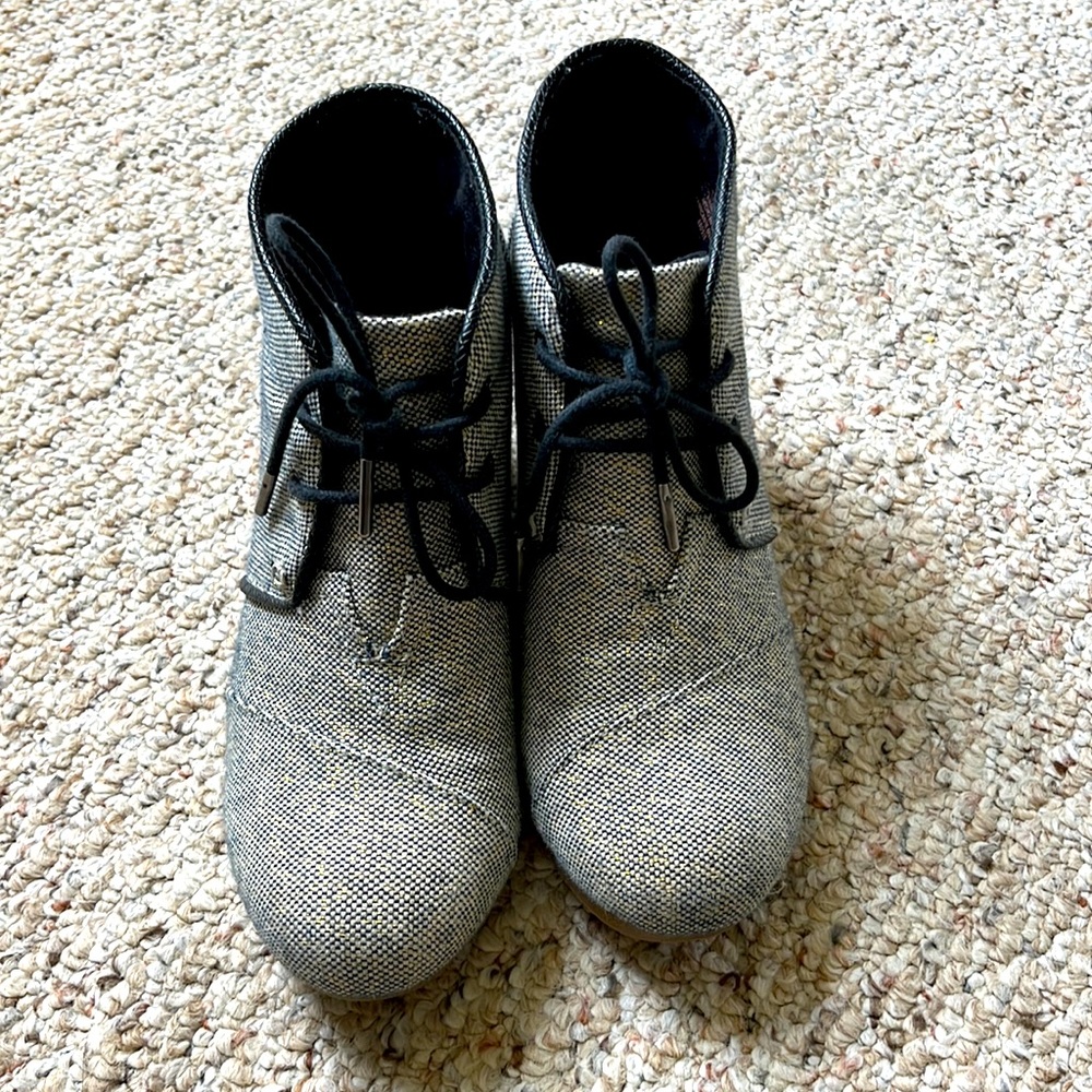 TOMS ankle wedge boots black and metallic gold.